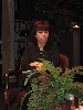 Artistic director Kate Maguire behind the ferns.