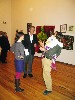 Dante Birch, director of exhibitions, has his hands full talking with Thompson.