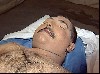 The corpse of Qusay Hussein, clearly not decapitated, on display to the media. 