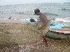 Fisherman emptying his net