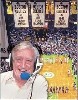 The legendary Johnny Most under all those banners at the Garden.
