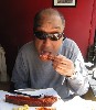 Cisco enjoying the moist and meaty ribs.