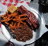 The generous rib plate with baked beans and sweet potato fries.