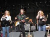 The trio of vocalists includes Amy Helm.