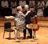 Blythe embraces her friend Norman Fischer. 