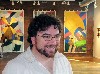 David Lane in front of his wall hangings. 