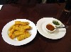 A yucca appetizer with two dipping sauces. 