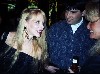 Sweetheart of the rodeo Miss Kim (English) left talks with journalist Susan Wornick.