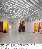 Interior gallery and see-through to next room. The ceilings light mottled by ovals.