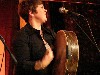 Lucy beating a drum. 
