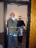 Jonas and Beingna behind the glass door of the gallery.