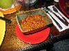 A small portion of chili with a  lack of flavor and beans. 