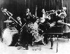 Armstrong joined King Oliver in Chicago.