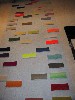 A loose grid of abstract paintings by Wanda Koop.