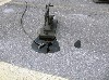 The apparatus manipulates mini oil rigs. 