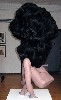 Big hair dominates a work by Barbara Blass.