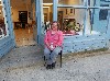 Louise LaFond sitting in front of an Eagle Street gallery she shares with gallerist Ralph Brill.