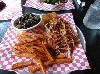 Pulled pork with sweet potato fires and collards.