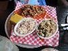 Pulled pork with cole slaw and dirty rice.
