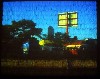 Video projected onto a wall of feathers by Alan Michelson.