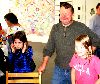 Jonathan Secor with his daughter, right, in the MCLA Annex gallery.