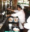 Pouring the coffee.