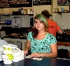 Allison serves visitors at the hang out Cup and Saucer.