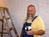 Artist curator Brian Jewett prepping walls for the new show at the Elipse Mill Gallery.