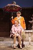 The unhinged Marjorie (Dana Ivey) puts up an umbrella on a sunny day to the amusement of Kathleen (Roberta Maxwell).