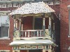 Second Floor Portico in Carpenter Gothic Style on North Adams Victorian House.
