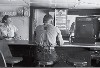Man in a hamburger stand, Alpine, Texas, May, 1939 by Russell Lee.
