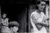 A family of a Resettlement Administration client in the doorway of their home, Boone County, Arkansas, October 1935 by Ben Shahn.
