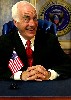 Richard Snee as the lame duck President Charles Smith.