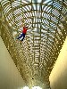 Looking up at the atrium designed by I.M.Pei with a falling man by Jonathan Borofsky.