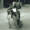 "An Old Beggar in a Wheelchair, Lintong County, Shaanxi Province, 1999"