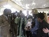 Dignitaries gathered in a tent.